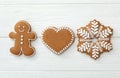 Different delicious Christmas cookies on white wooden table, flat lay Royalty Free Stock Photo