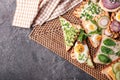 Different delicious toasts on wicker mat Royalty Free Stock Photo