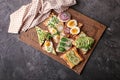 Different delicious toasts on wicker mat Royalty Free Stock Photo