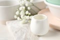 Different dishware and marble board on table, space for text