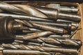 Different drills in a box. pile of drill bits in a case. work tools Royalty Free Stock Photo