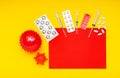 Different drugs, medicines tablets syringes against coronavirus, blood cancer, leukemia. Copy space on red, yellow background.