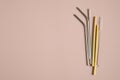 Different eco-friendly drinking straws set. Stainless steel metal, bamboo, glass reusable drinking straws. Flat lay, top view. Royalty Free Stock Photo