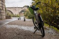 Different electric mobility options in the city of rome. Focus on the electric bike, electric scooters in the background. Visible