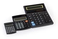 Different electronic calculators laid out in row on white background Royalty Free Stock Photo