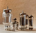 Different electronic vacuum tubes on kraft paper background in warm colours. Royalty Free Stock Photo