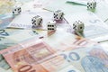 Different Euro banknotes and dices wih dice box. Concept of gambling Royalty Free Stock Photo