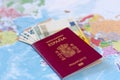 Different euro banknotes inside of the Spanish travel passport Royalty Free Stock Photo