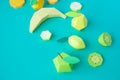 Different exotic fruits made of paper on trendy mint background