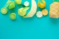 Different exotic fruits made of paper on trendy mint background