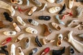 Different female shoes abstract arrangement on beige carpet flooring fashion shopping background Royalty Free Stock Photo