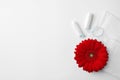 Different feminine hygiene products and flower on white background, top view with space for text