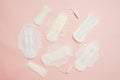 Different feminine sanitary napkins (sanitary pads) with tampon on pink background. Menstruation Royalty Free Stock Photo