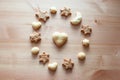 Different figures of ginger biscuits on a wooden table. Christmas cookies, star figures, heart figures, moon figure, and