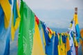 Different flags on the top of the mountain