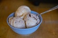 The different flavor ice cream scoops side view on wooden table background Royalty Free Stock Photo