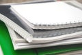 Different folders, documents and notebooks close-up. Business papers on the office desk.