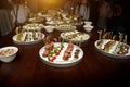 Different food snacks and appetizers in round plates on corporate event party. Celebration with catering banquet table. Royalty Free Stock Photo