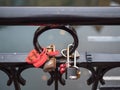 Different form of locks, locked on the fence above the chanel in Colmar Royalty Free Stock Photo