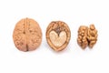 Different forms and areas of walnut. Walnut half in the form of a heart and peeled nut on a white background, isolated