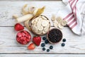 Different freeze dried and fresh fruits on white wooden table, flat lay Royalty Free Stock Photo