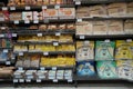 Different fresh bread on the shelves in bakery. Interior of a modern grocery store showcasing the bread aisle with a variety of