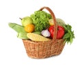 Different fresh fruits and vegetables in wicker basket isolated on white Royalty Free Stock Photo