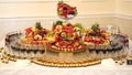 Different fresh fruits on wedding buffet table. Fruits and berries Wedding table decoration. Buffet reception fruit Royalty Free Stock Photo