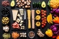 Different fresh ingredients for cooking italian pasta, spaghetti, fettuccine, fusilli and vegetables on a black Royalty Free Stock Photo