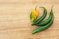 Different fresh ripe peppers on wooden table, flat lay. Space for text Royalty Free Stock Photo