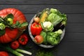 Different fresh vegetables and fruits on black wooden table, flat lay. Farmer harvesting Royalty Free Stock Photo