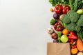 Different fresh vegetables in paper bag on white background, space for text. Ai generative Royalty Free Stock Photo