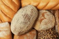 Different freshly baked breads in wicker tray