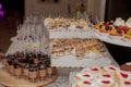 Different fruit desserts with fruits in glasses on the table. Restaurant presentation, food, party concept