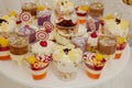 Different fruit desserts with fruits in glasses on the table. Restaurant presentation, food, party concept