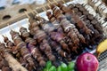 Different fruit sticks: Fresh strawberries,bananas covered with white and dark chocolate for sale on local market place