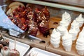 Different fruit sticks: Fresh strawberries,bananas covered with white and dark chocolate for sale on local market place in Vienna. Royalty Free Stock Photo