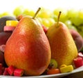 different fruits and sweets on wooden table close-up Royalty Free Stock Photo