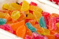 Different gelatin sweet fruit candy candies sugar. Assorted colorful jelly sweets. Colored confectionery for kids.