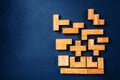 Different geometric shapes wooden blocks on a dark background. Creative, logical thinking and problem solving concept. Copy space Royalty Free Stock Photo