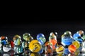 Different glass balls on black background Royalty Free Stock Photo