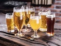 Different glasses of beer on the wooden table. Royalty Free Stock Photo