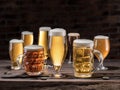 Different glasses of beer on the wooden table. Royalty Free Stock Photo