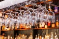 different glasses hanging over the bar. Soft focus. selective focus Royalty Free Stock Photo