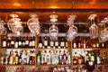 different glasses hanging over the bar. Soft focus. selective focus Royalty Free Stock Photo