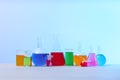 Different glassware with samples on table. Solution chemistry Royalty Free Stock Photo