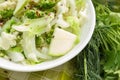 Different green and white, fresh, raw vegetables in the white bowl with flax seeds Royalty Free Stock Photo