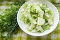 Different green and white, fresh, raw vegetables in the white bowl Royalty Free Stock Photo