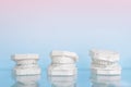 Different gypsum human jews model on glass shelf at dentist office on light blue background. Dentistry and prosthetic laboratory.