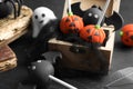 Different Halloween themed cake pops on black table